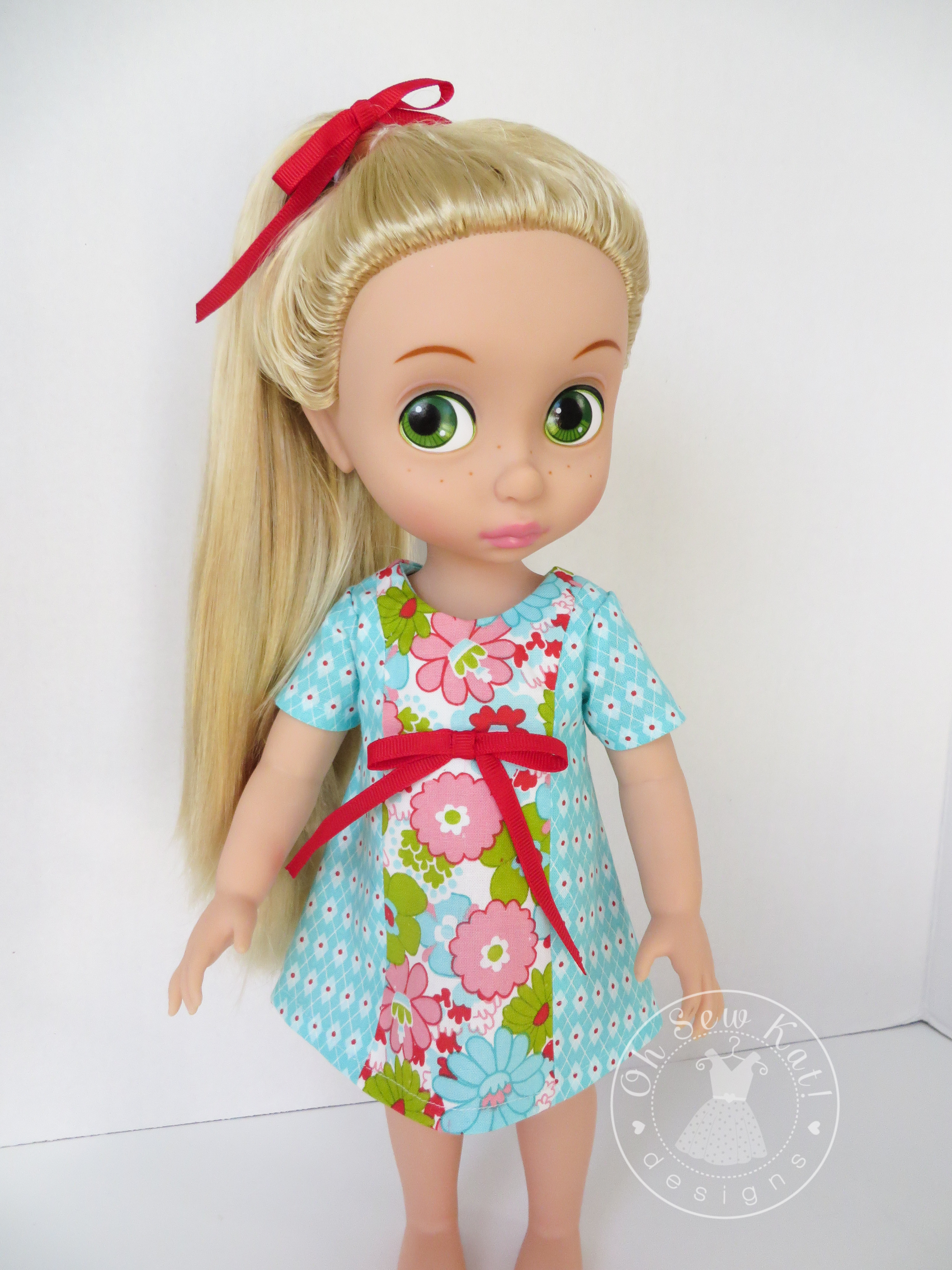 Make a simple summer dress for your 18 inch doll with the Sunshine Dress PDF Pattern from OhSewKat! Also available for 16 inch dolls like Animators. #dollclothes #sewingpattern #summerclothes #dolloutfit #sunshinedress #ohsewkat #animators