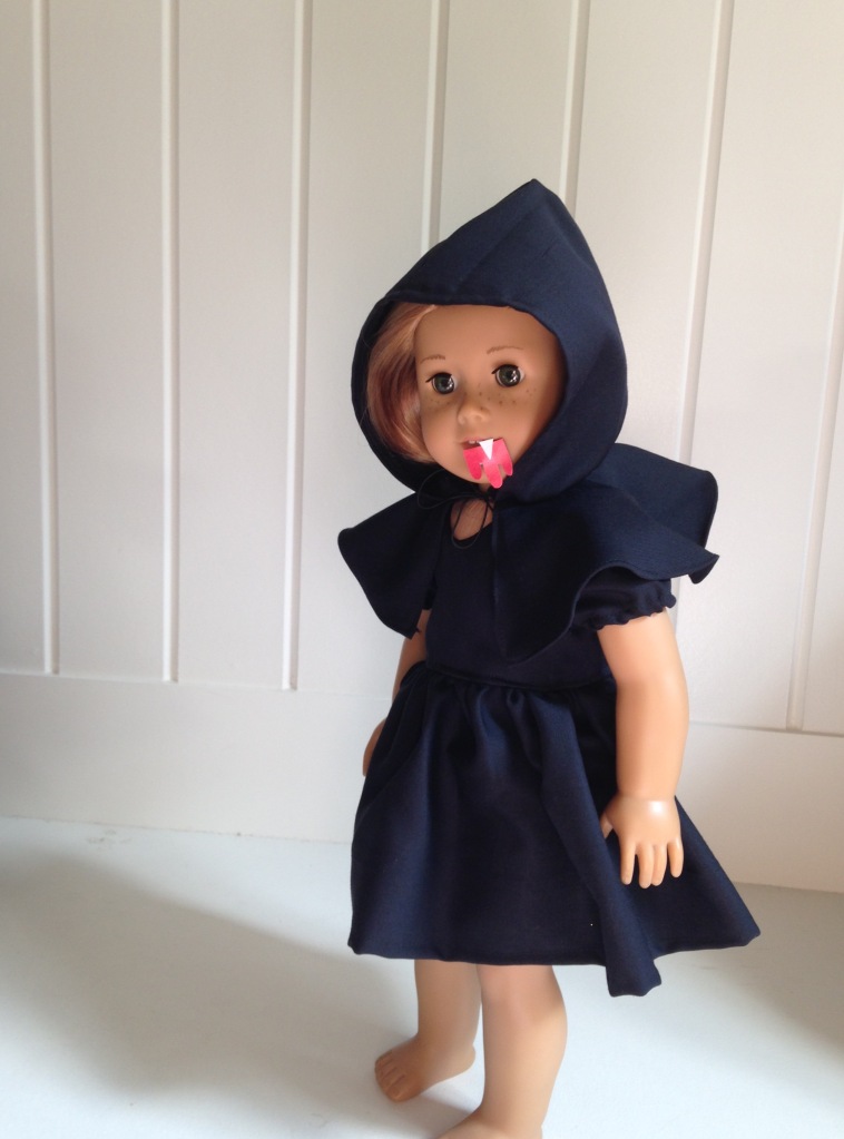 Make a Halloween costume for your 18 inch American Girl doll with easy sewing patterns from Oh Sew Kat! Free skirt pattern can be found at www.ohsewkat.com. #batcostume #halloween #diy #dollclothes #sewingpattern #ohsewkat