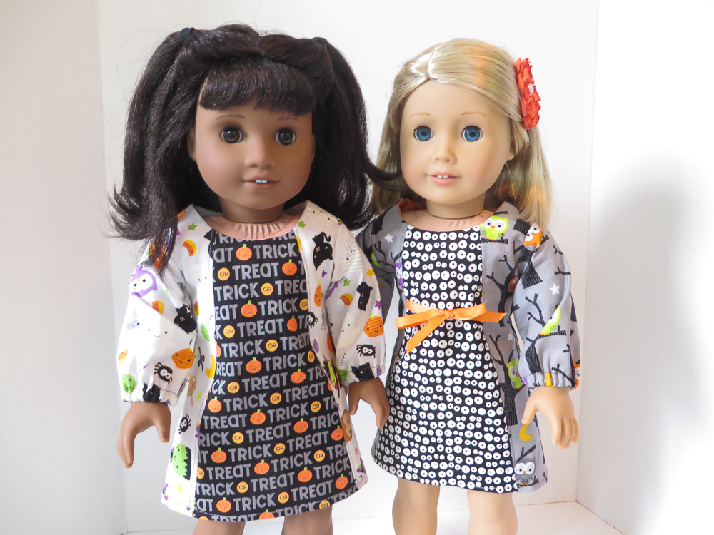 Halloween fashions and Fall dresses to sew for 18 inch dolls like American Girl with easy sewing patterns from Oh Sew Kat! Make cute pumpkin or spooky bat doll dresses with this print at home easy PDF pattern. #halloween #pumpkins #dollclothes #fallfashions #ohsewkat