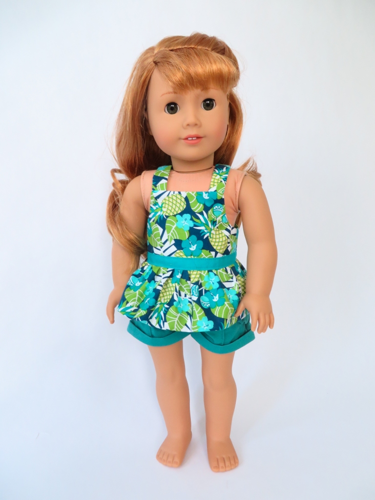Use the Backyard Bibs PDF sewing pattern to make as summer doll top for your 18 inch American Girl doll. Easy sewing patterns for all seasons by Oh Sew kat!