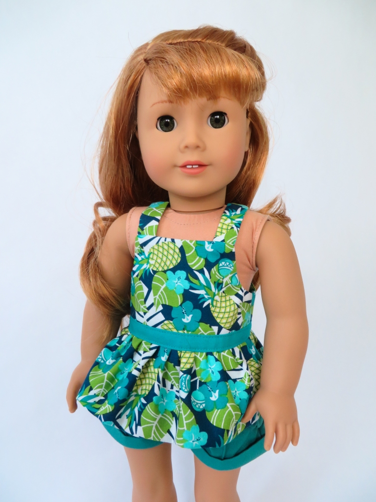 Use the Backyard Bibs PDF sewing pattern to make as summer doll top for your 18 inch American Girl doll. Easy sewing patterns for all seasons by Oh Sew kat!