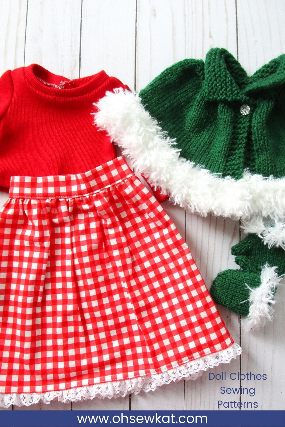 Doll clothes laying flat: red Jumping Jack turtleneck, red gingham skirt, and knitted green cape and mittens with white fur trim